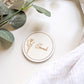Boho wedding round wooden place name on a natural table setting