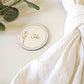 Engraved round wooden place name with Sarah design