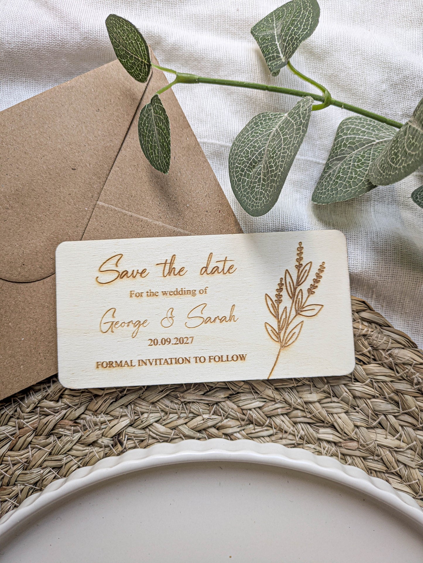 Engraved wooden save the date card styled with kraft envelope