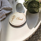 Personalised round disc place card with laser engraved guest name