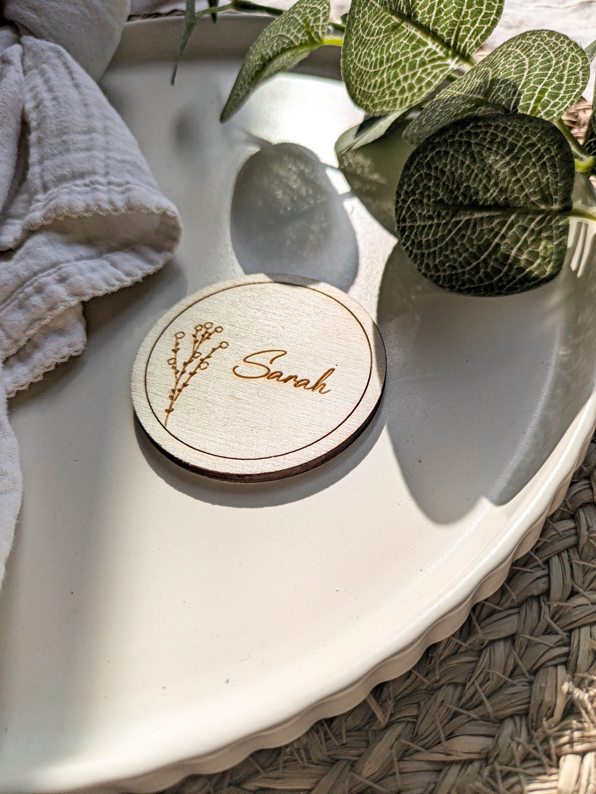 Personalised round disc place card with laser engraved guest name