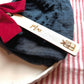Christmas present design: personalised wooden Christmas place name with Max, styled on a napkin