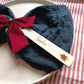 Christmas tree design: personalised wooden Christmas place name with Sophie, styled on a napkin