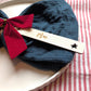 Cut out star design: personalised wooden Christmas place name with Max, styled on a napkin