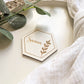 Personalised wooden hexagon wedding place name with Sienna engraving on neutral table styling