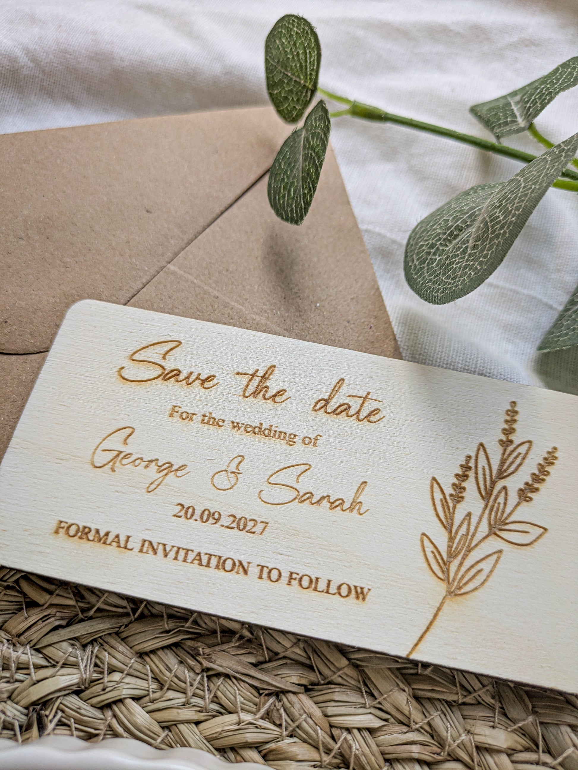 Rustic wooden wedding save the date card with botanical engraved design