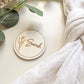 Wooden circle place name used as a personalised wedding favour