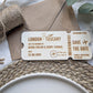 Wooden save the date ticket showing rounded edges and engraved boarding pass details