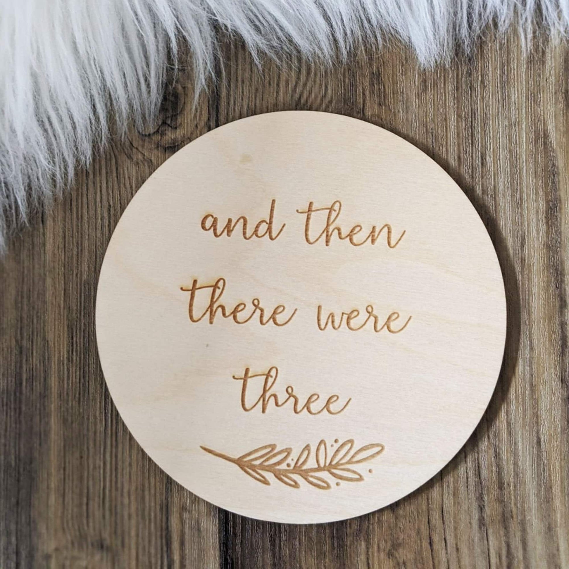 https://markmyword.co.uk/cdn/shop/products/Personalised-And-then-there-werethree-baby-announcement-Disc-9cm145cm.jpg?v=1647737280&width=1946